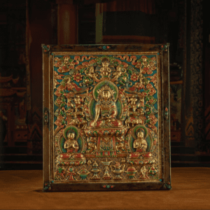 RADIANCE OF COMPASSION – 19TH CENTURY GILT COPPER JOWO BUDDHA WALL THANGKA